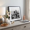 image:imageAmericanflat 8x10 Picture Frame with ShatterResistant Glass  Use as 5x7 Frame with Mat or Display 8x10 Photo Without Mat  Streamline Collection  Picture Frames for Tabletop and Wall  White  Shatterresistant glass wall or tabletop display with included easel sawtooth hangers included secure turntab backingBlack