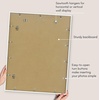 image:imageAmericanflat 8x10 Picture Frame with ShatterResistant Glass  Use as 5x7 Frame with Mat or Display 8x10 Photo Without Mat  Streamline Collection  Picture Frames for Tabletop and Wall  White  Shatterresistant glass wall or tabletop display with included easel sawtooth hangers included secure turntab backingWhite