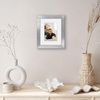 image:imageAmericanflat 8x8 Picture Frame  Matted to 5x5  Engineered Wood  White  Shatterresistant glass wall or tabletop display with included easel sawtooth hangers included secure turntab backingSilver