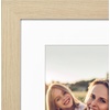 image:imageAmericanflat 8x8 Picture Frame  Matted to 5x5  Engineered Wood  White  Shatterresistant glass wall or tabletop display with included easel sawtooth hangers included secure turntab backingNatural Oak