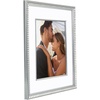 image:imageAmericanflat 8x10 Picture Frame with ShatterResistant Glass  Use as 5x7 Frame with Mat or Display 8x10 Photo Without Mat  Streamline Collection  Picture Frames for Tabletop and Wall  Gold  Shatterresistant glass wall or tabletop display with included easel triangle hangers included secure turntab backingSilver